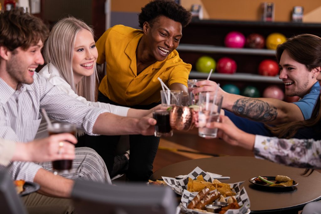 people eating and bowling